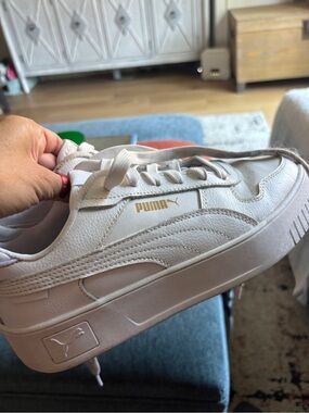 Puma Women's White Sneakers with Gold Logo Accent